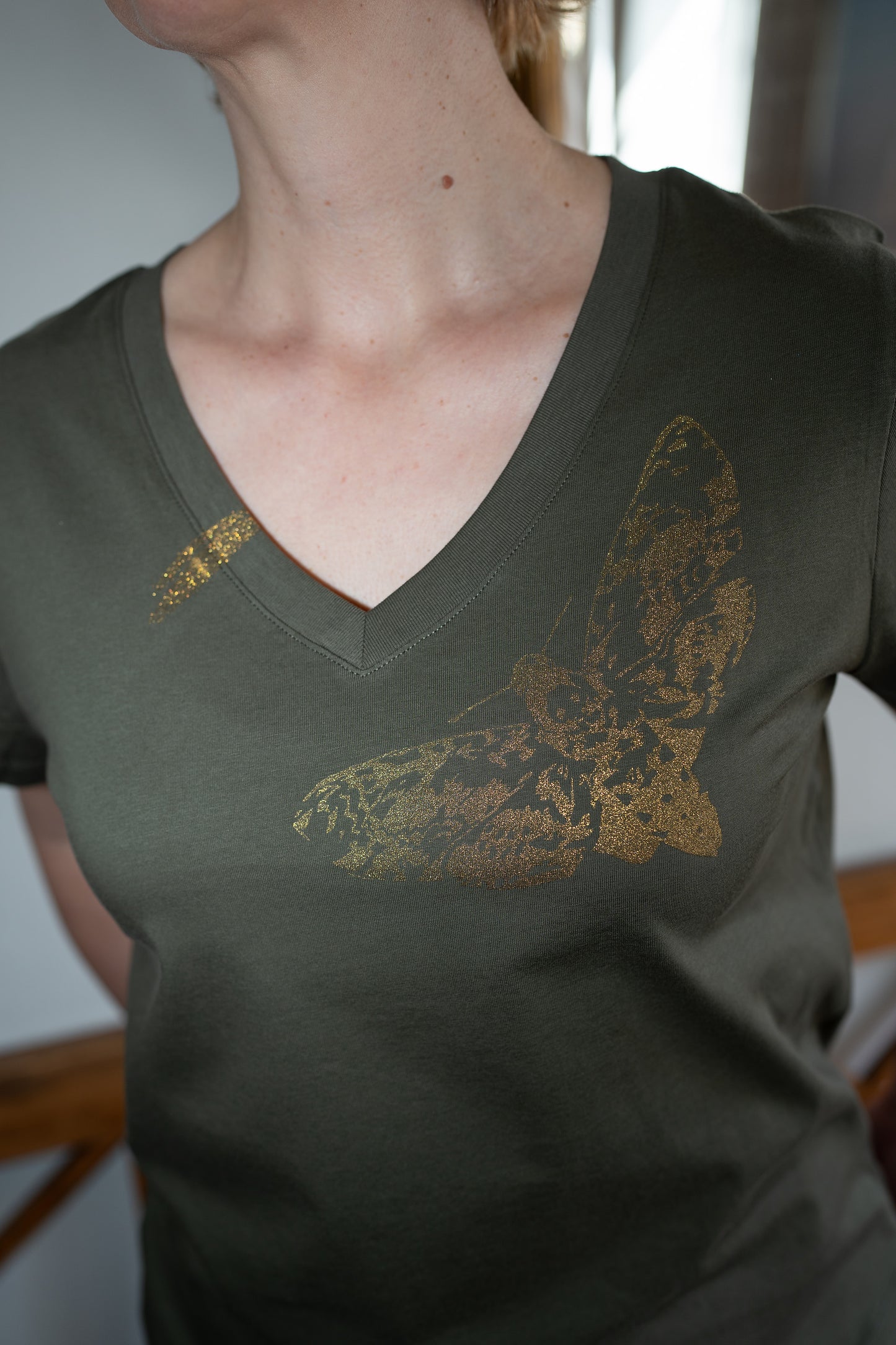 V-neck T-shirt with golden butterfly 